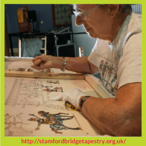 Doreen Savory working on the back of a panel Battle Of Stamford Bridge Tapestry – Stitchery Stories Podcast Episode
